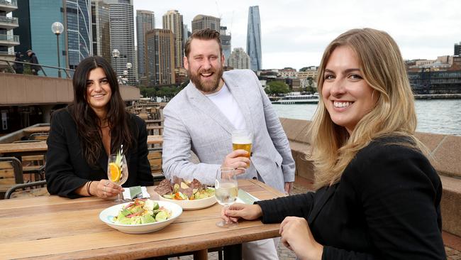 CBD office workers have been enjoying lunches out again. Veronika Zaferis, Steve Davis and Jess Wright enjoy a meal and drinks at the Opera Bar. Picture: Toby Zerna