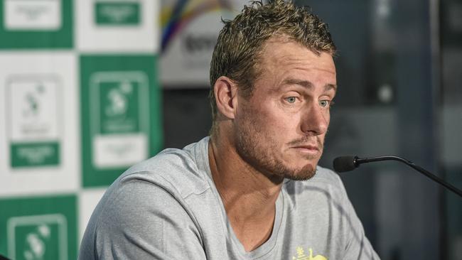 A glum Lleyton Hewitt addresses the media about the future of the Davis Cup.AAP Image/Roy VanDerVeg