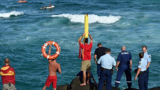 Police and surf lifesavers search for this week’s drowning victim from the rocks at Fingal Head.