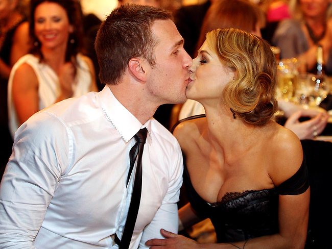 Dane Swan kisses girlfriend Taylor Wilson after being announced as the Brownlow Medal winner for 2011. Picture: Michael Klein