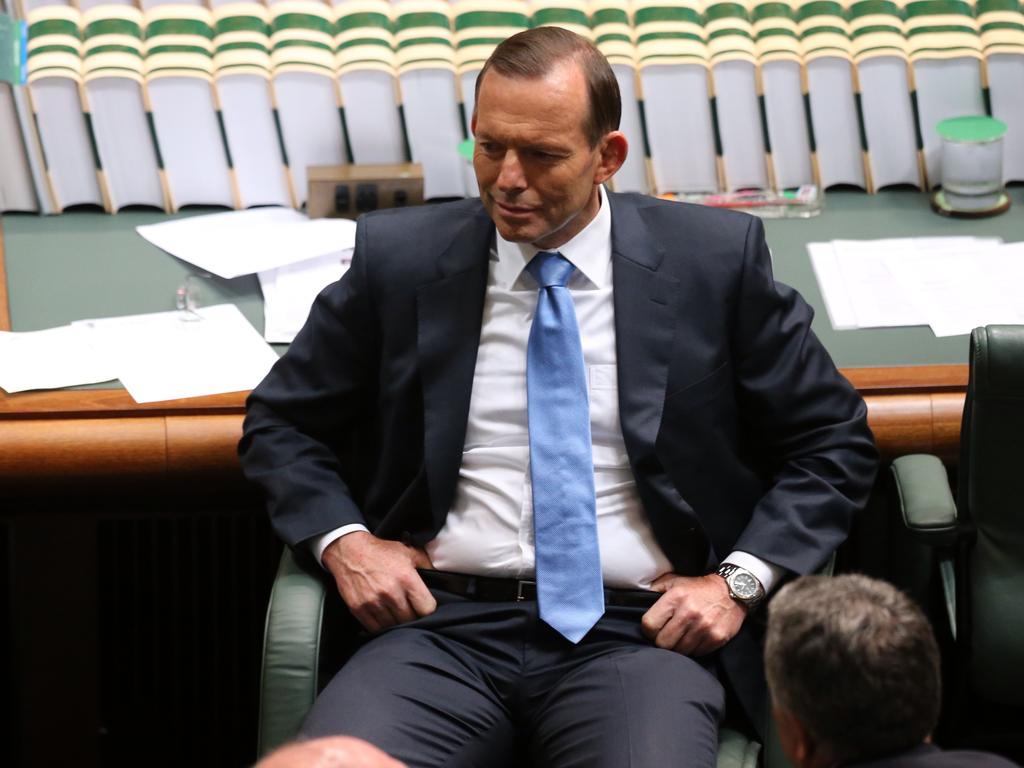 Then Prime Minister Tony Abbott confers with his front bench during Question Time. Picture: Supplied