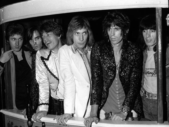 Members of the Rolling Stones Mick Taylor, Nicky Hopkins, Mick Jagger, Charlie Watts, Keith Richards and Bill Wyman conduct press conference from an inside an old Bondi tram during their 1973 tour. Pic Milton Wordley.