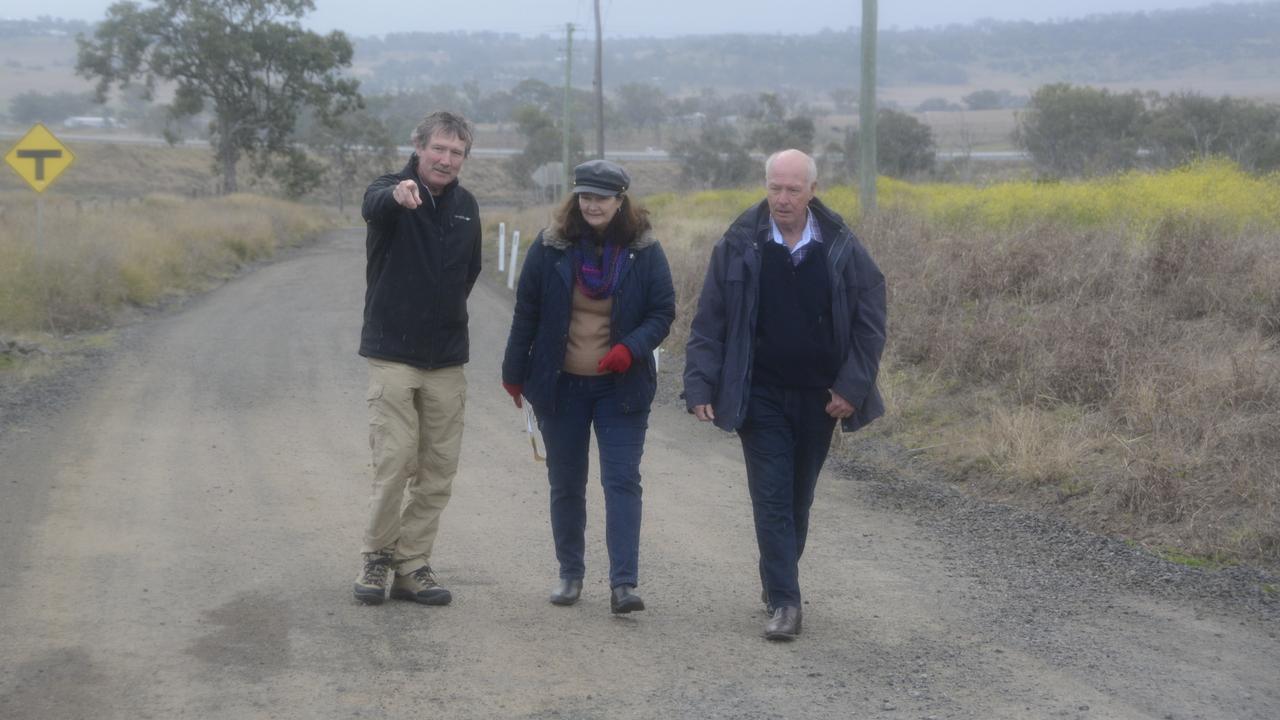 Michael Thompson, Kerry Wilkie and Chris Tait inspect the potholes and damage along Nugents Pinch Road at Cotswold Hills.