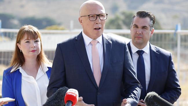 Hawke Liberal candidate Simmone Cottom, Peter Dutton and housing spokesman Michael Sukkar at a new homes construction site in Maddingley. Picture: Richard Dobson / Newswire