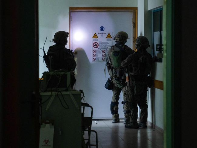 This handout picture released by the Israeli army on November 15, 2023, reportedly shows Israeli soldiers carrying out operations inside Al-Shifa hospital, amid continuing battles betweeen Israel and the Palestinian militant group Hamas. (Photo by Israeli Army / AFP) / RESTRICTED TO EDITORIAL USE - MANDATORY CREDIT "AFP PHOTO / ISRAELI ARMY " - NO MARKETING NO ADVERTISING CAMPAIGNS - DISTRIBUTED AS A SERVICE TO CLIENTS