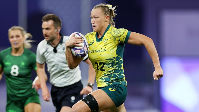 Maddison Levi of Team Australia breaks clear to score her team's third try during the Women's Rugby Sevens Quarter Final match. Picture: Michael Steele/Getty Images.