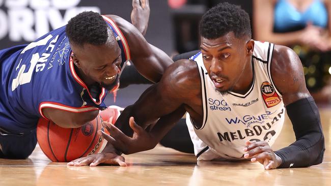 Adelaide 36ers’ Majok Deng and Melbourne United’s Casey Prather.