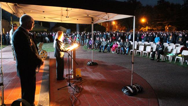 The crowd listens to Isobel Cameron as she reads out a letter from her great, great grandfather William Hart Room to his father dated May 2, 1915. Picture: ROSS MARSDEN