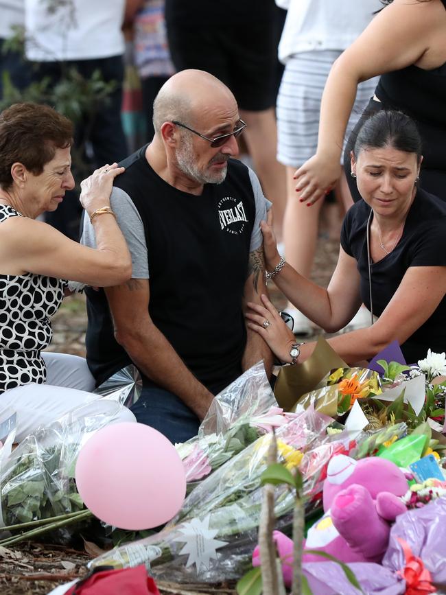 Family and friends mourn the deaths of the four children. Picture: Jonathan Ng