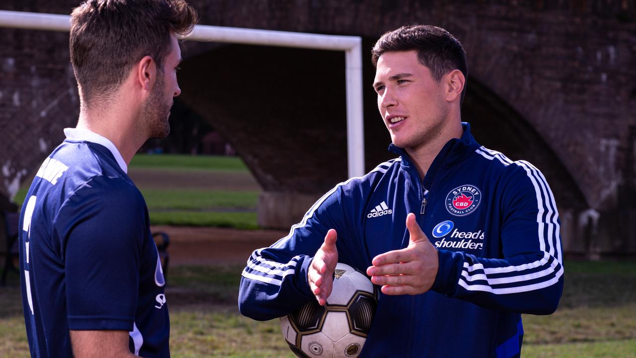 Sydney CBD FC captain Mark Anthony Smith talks tactics with Mitchell Moses. Picture: Peter Teys