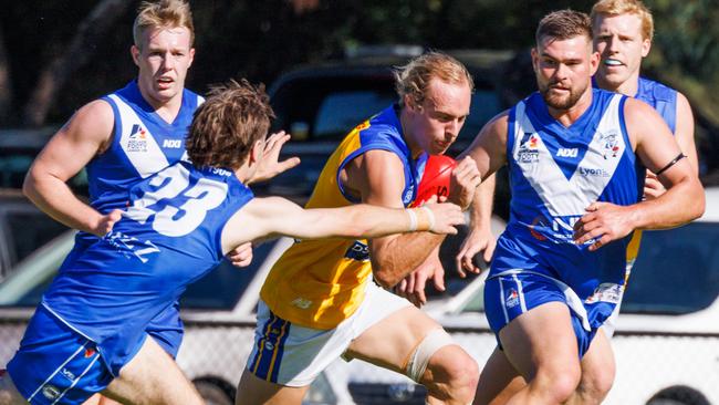 Mitch Grigg (right) chases PHOS Camden's Henry Papatolis (middle). Picture: Dwayne Flight