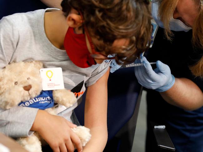 TGA head John Skerritt said there were ‘a lot of reasons’ that children under 12 should get the jab. Picture: JEFF KOWALSKY / AFP