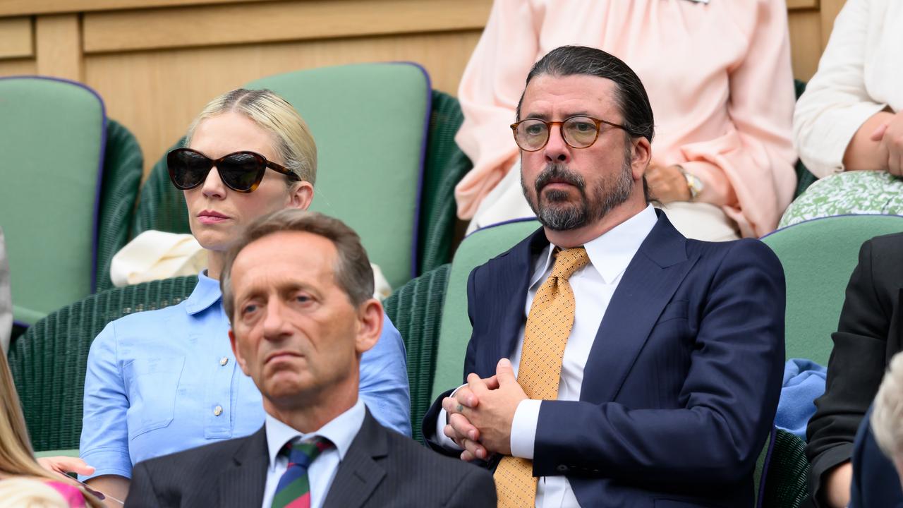 Dave Grohl and Jordyn Blum attend day two of the Wimbledon Tennis Championships. Photo by Karwai Tang/WireImage.