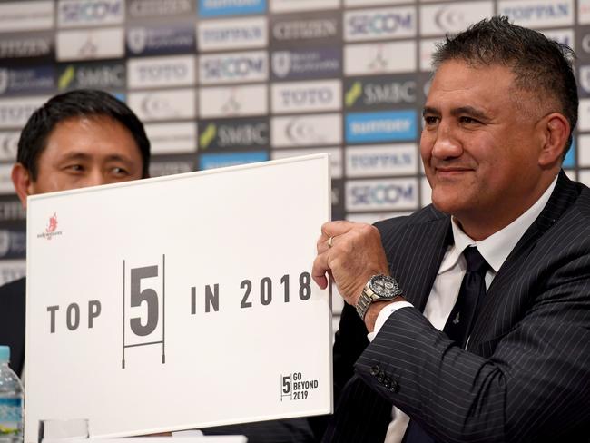 Japan's Super Rugby team, Sunwolves head coach Jamie Joseph (R) displays the team's target for 2018 season during a press conference announcing the team's 2018 activities and squad in Tokyo on December 4, 2017. Joseph said on December 4 he was targeting a top-five finish next season, despite the team being on the wrong end of multiple hidings in recent years. / AFP PHOTO / Toshifumi KITAMURA