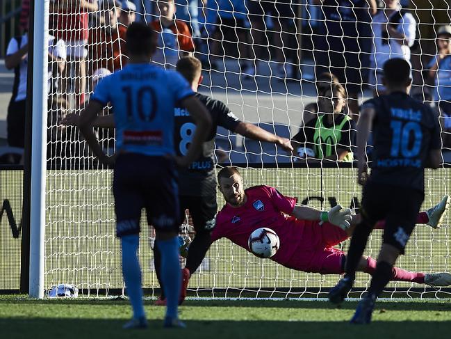 SYDNEY, AUSTRALIA - FEBRUARY 03: Andrew Redmayne of Sydney makes a save against a penalty kick during the round 17 A-League match between Sydney FC and Melbourne City at WIN Jubilee Stadium on February 03, 2019 in Sydney, Australia. (Photo by Brett Hemmings/Getty Images)