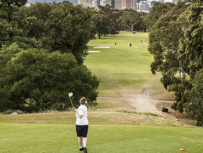 HOT WEATHER PHOTO - regular golfers tee off on the third hole at North Adelaide Golf Course, Friday, November 10, 2017 (overcast 23degrees at 7.35) - pic AAP/MIKE BURTON