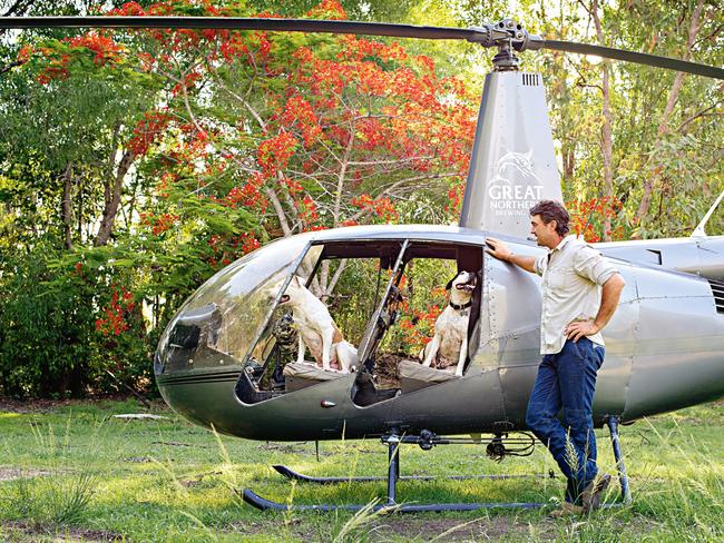 Wright, pictured with his dogs, runs three helicopters. (Picture: Michael Franchi)