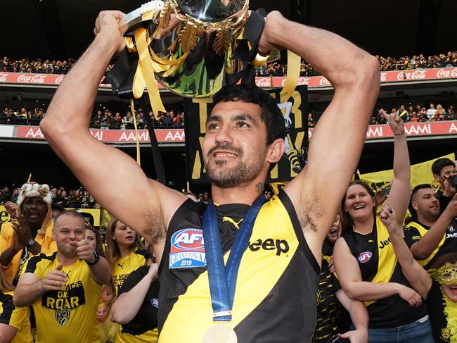 Marlion Pickett of the Tigers celebrates the win with the Premiership Cup during the 2019 AFL Grand Final between the Richmond Tigers and the GWS Giants at the MCG in Melbourne, Saturday, September 28, 2019. (AAP Image/Michael Dodge) NO ARCHIVING