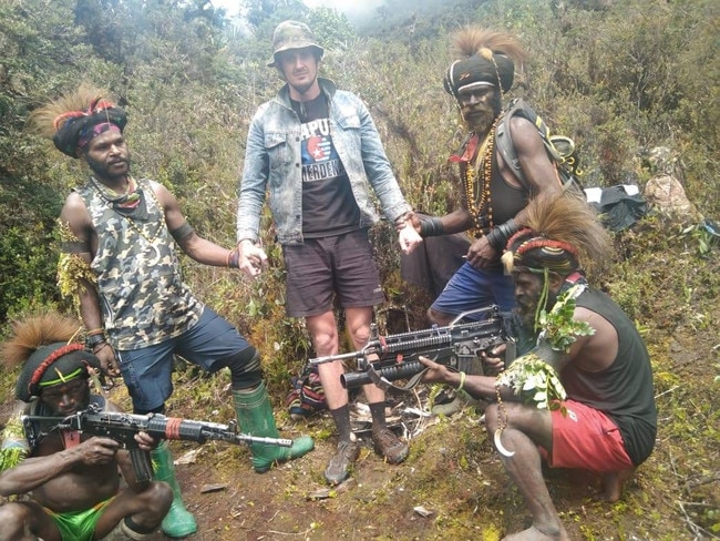 Philip Mehrtens pictured with fighters from the West Papuan National Liberation Army, the armed wing of the Free Papuan Movement, which is calling for independence from Indonesia.