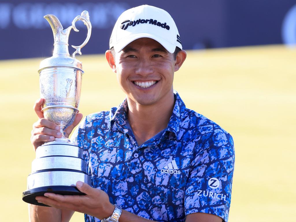 Open Champion, Collin Morikawa of United States celebrates with the Claret Jug.