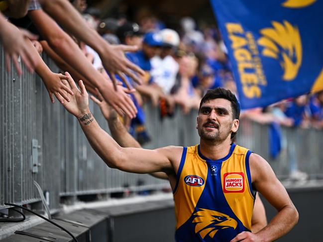 PERTH, AUSTRALIA - MARCH 26: Tom Cole of the Eagles celebrates the win with the fans during the 2023 AFL Round 02 match between the West Coast Eagles and the GWS Giants at Optus Stadium on March 26, 2023 in Perth, Australia. (Photo by Daniel Carson/AFL Photos via Getty Images)