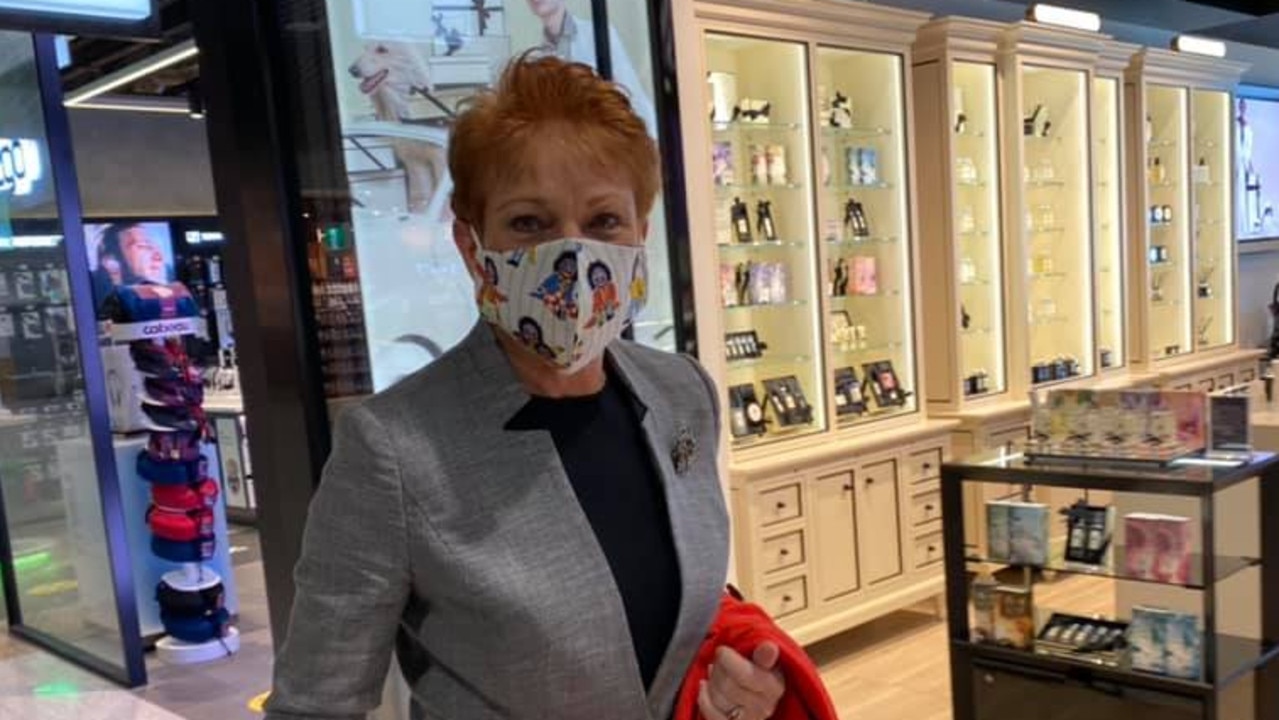 Senator Hanson at an airport wearing her golliwog mask in April. Picture: Facebook One Nation.