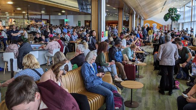 A crowded departure lounge at Hobart Airport as flights were delayed or cancelled. Picture: AMANDA DUCKER