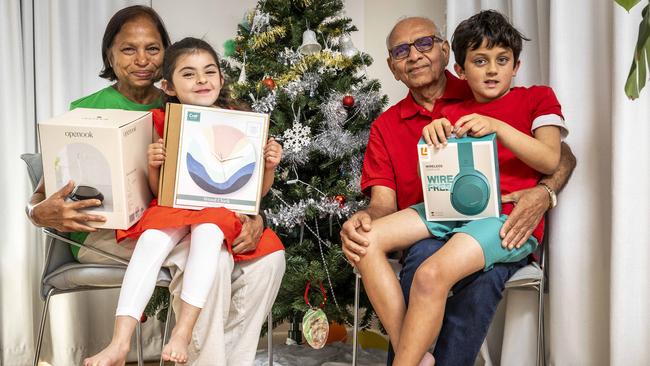 Nisha and Anant Nigam with their grandkids Natasha, 5, and Nevan, 8. Picture: Jake Nowakowski