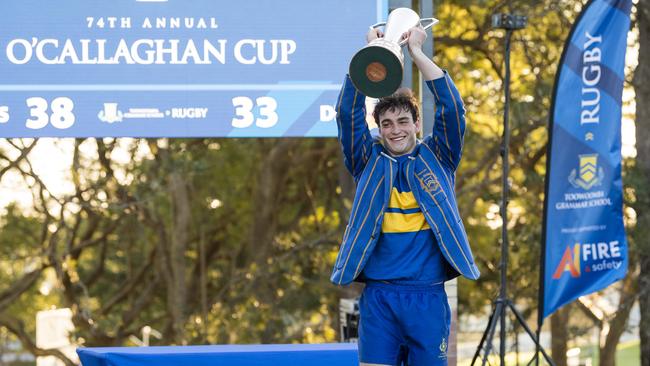 TGS1st XV captain George Griffiths lifts the O'Callaghan Cup after Grammar defeat Downlands on Grammar Downlands Day at Toowoomba Grammar School, Saturday, August 19, 2023. Picture: Kevin Farmer