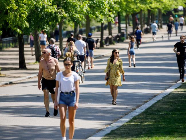 People go for a walk in Victoria Park in east London during the national lockdown due to the novel coronavirus COVID-19 pandemic. Picture: AFP