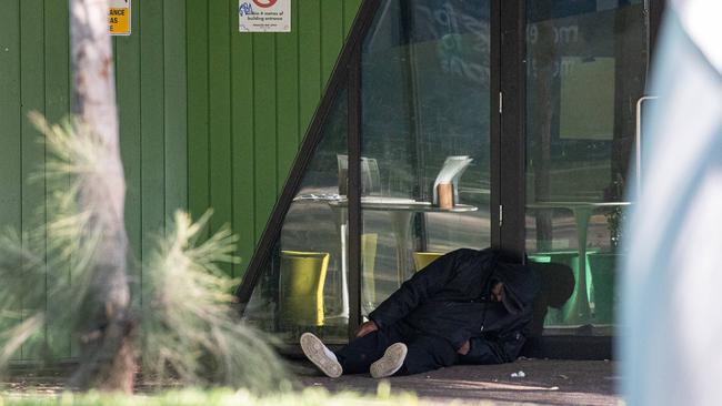 A person slumped outside Richmond’s safe injecting room. Picture: Jason Edwards