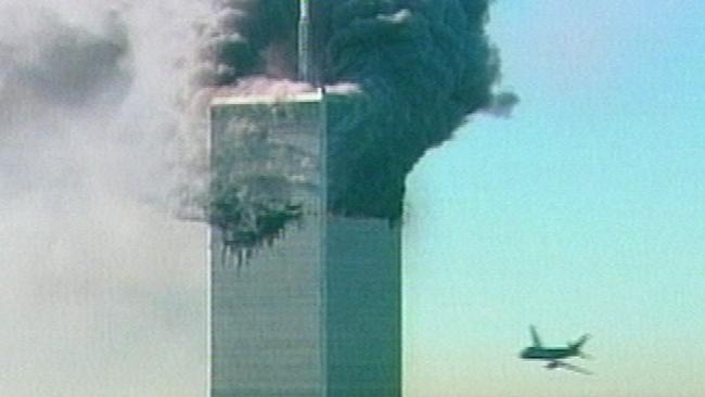 SEPTEMBER 11, 2001 : An aircraft at right about to fly into the the World Trade Centre in New York in this image made from television, 11/09/01. The hijacked aircraft was the second to fly into the towers. USA / Crime / Fire / Bombing / Aviation / Hijacking / Terrorism