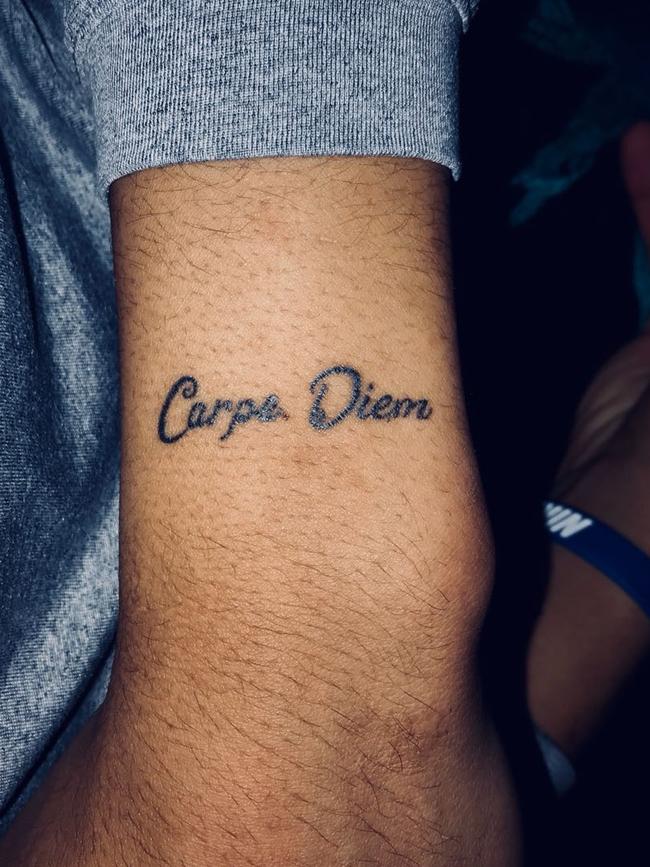 Jacob Wiley's tattoo on his wrist which says 'Carpe Diem'.