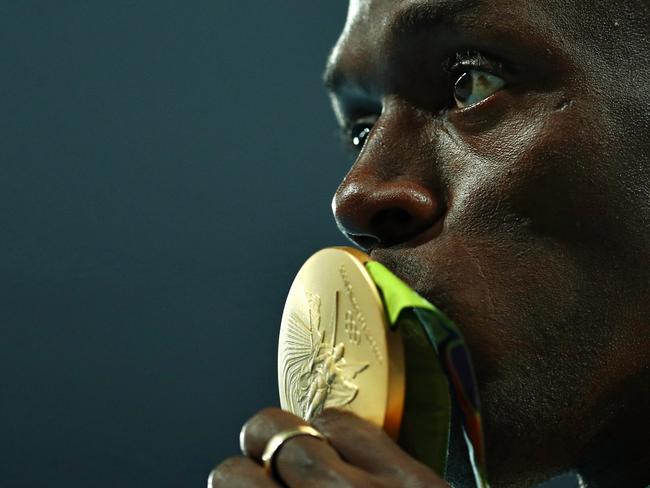 Usain Bolt kisses his gold medal on the podium during the medal ceremony for the Men’s 100 metres at the Rio 2016 Olympic Games on August 15, 2016. Picture: Getty