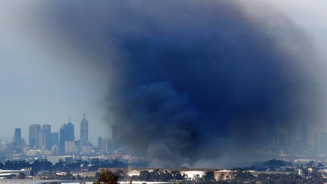 Toxic smoke and ash are blown over Melbourne from a recycling plant fire in Coolaroo on a windy day in Melbourne. Picture: Nicole Garmston