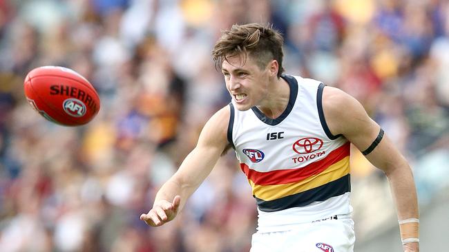 Jake Kelly of the Crows kicks the ball away against Brisbane. Picture: Jono Searle/AFL Photos/Getty Images