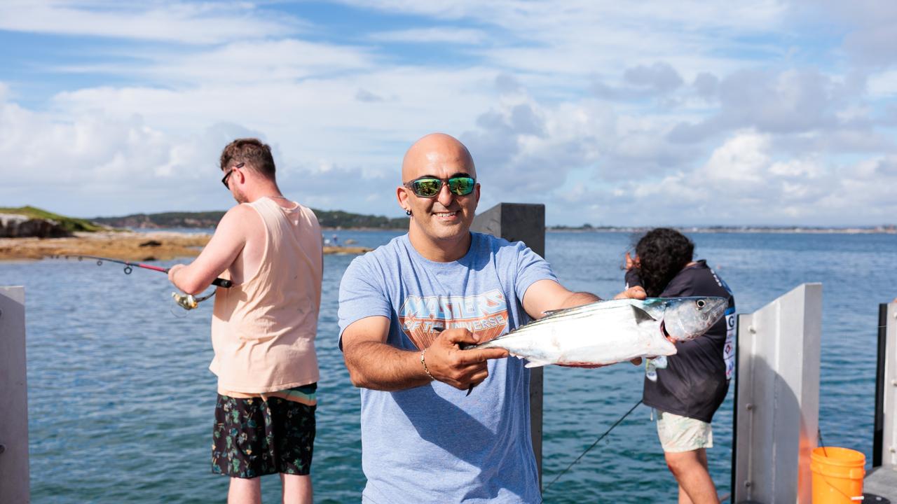 Local resident Tom Vardaoulis shows off the 52cm Bonito fish he caught off the ferry wharf at La Perouse on Sunday morning. Picture: Chris Huang (Matrix)