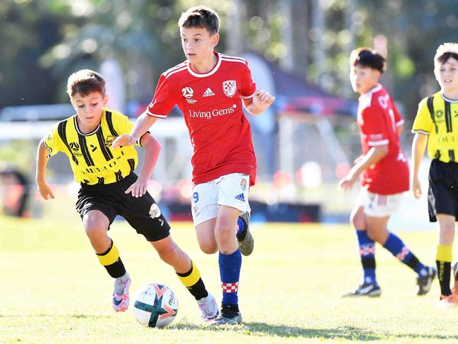 SOCCER: Junior football carnival, Maroochydore. Gold Coast Knights (red) V  Morton Bay United, boys. Picture: Patrick Woods.