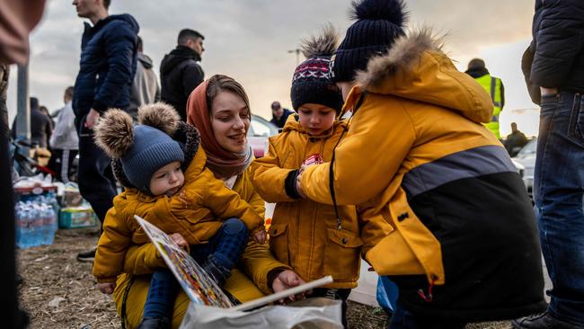 Ukrainian refugees arrive from the Medyka pedestrian border crossing, in Przemsyl, eastern Poland. Picture: Wojtek Radwanski/AFP