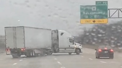 A woman caught the terrifying moment a semi-truck slid across multiple lanes of traffic and jackknifed on a highway in Kansas City, Missouri, on Saturday, January 4, as a major winter storm moved through the region. Credit: Gracie Fudge via Storyful