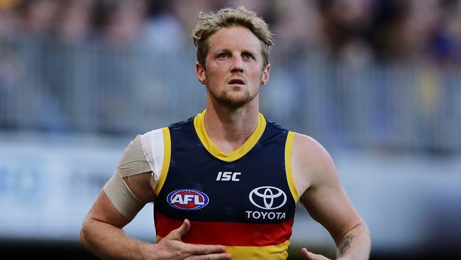 Rory Sloane of the Crows leaves the field with an eye injury. Picture: Will Russell/AFL Photos via Getty Images