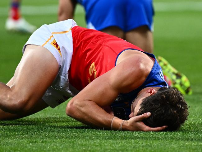 HOBART, AUSTRALIA - MAY 11: Jarrod Berry of the Lions stays down after a collision with Luke McDonald of the Kangaroos during the round nine AFL match between North Melbourne Kangaroos and Brisbane Lions at Ninja Stadium, on May 11, 2025, in Hobart, Australia. (Photo by Steve Bell/Getty Images)