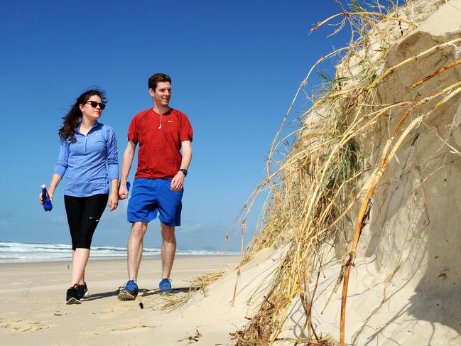 Becky and Daniel Corr from England. Narrow Neck, beach erosion and windy weather. Picture: John Gass