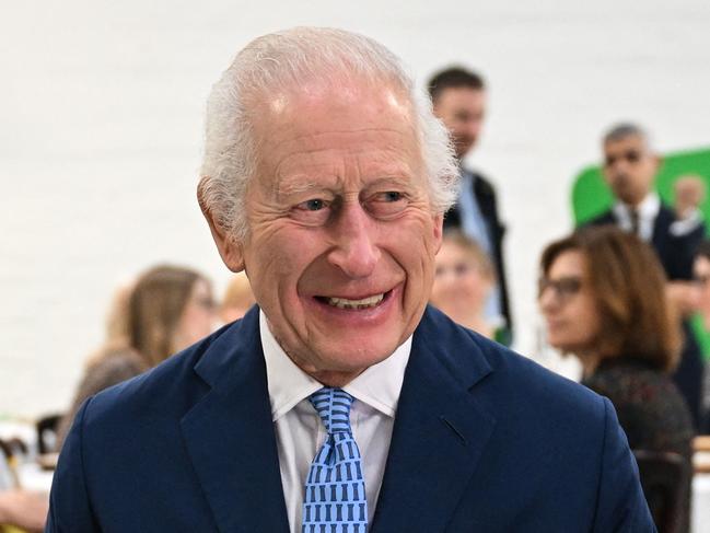 Britain's King Charles III (L) speaks with pupils of the primary school Rye Oak benefiting from the Coronation Food Project, as he visits to the Coronation Food Project hub, located at the Deptford Trading Estate, in southeastern London, on November 14, 2024, during the centre inauguration. To celebrate his 76th birthday and the first anniversary of the Coronation Food Project, the King opened the initiativeâs first two Coronation Food Hubs â one in person and one virtually. The hubs are major distribution centres, designed to save and circulate surplus food and to support communities in need. (Photo by JUSTIN TALLIS / POOL / AFP)