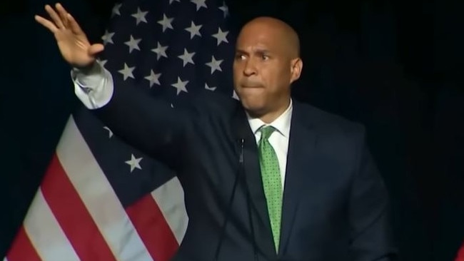 Cory Booker's gesture, which is being compared to Elon Musk's.