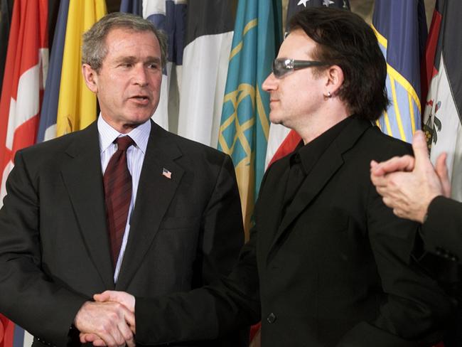 Handshake: George W Bush discusses relieving third world debt with Bono in 2002.
