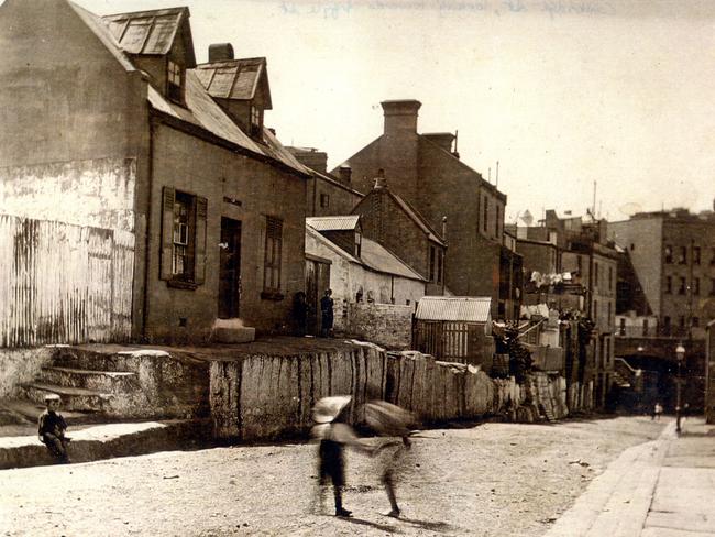 This historical picture of The Rocks shows children playing in Cambridge St looking to the Argyle Cut. Picture: Supplied