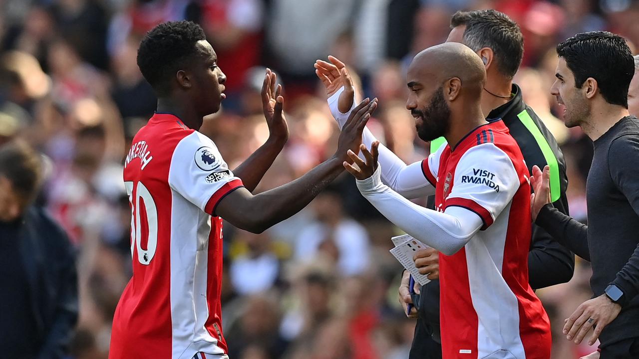 Eddie Nketiah (left) scored twice in the first 10 minutes. (Photo by Glyn KIRK / AFP)