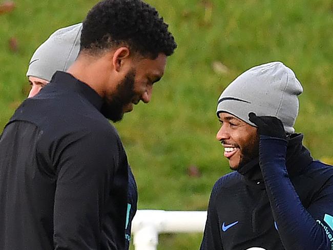 England's defender Joe Gomez (L) and England's midfielder Raheem Sterling attend an England team training session at St George's Park in Burton-on-Trent, central England on November 12, 2019, ahead of their Euro 2020 football qualification match against Montenegro. (Photo by Paul ELLIS / AFP) / NOT FOR MARKETING OR ADVERTISING USE / RESTRICTED TO EDITORIAL USE