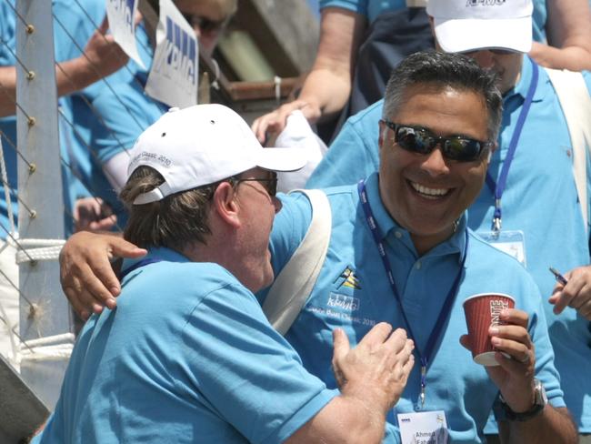 Fahour (right) hams it up with former federal treasurer Peter Costello it out on the water during the annual KPMG Couta Boat Race at Sorrento back in 2010.